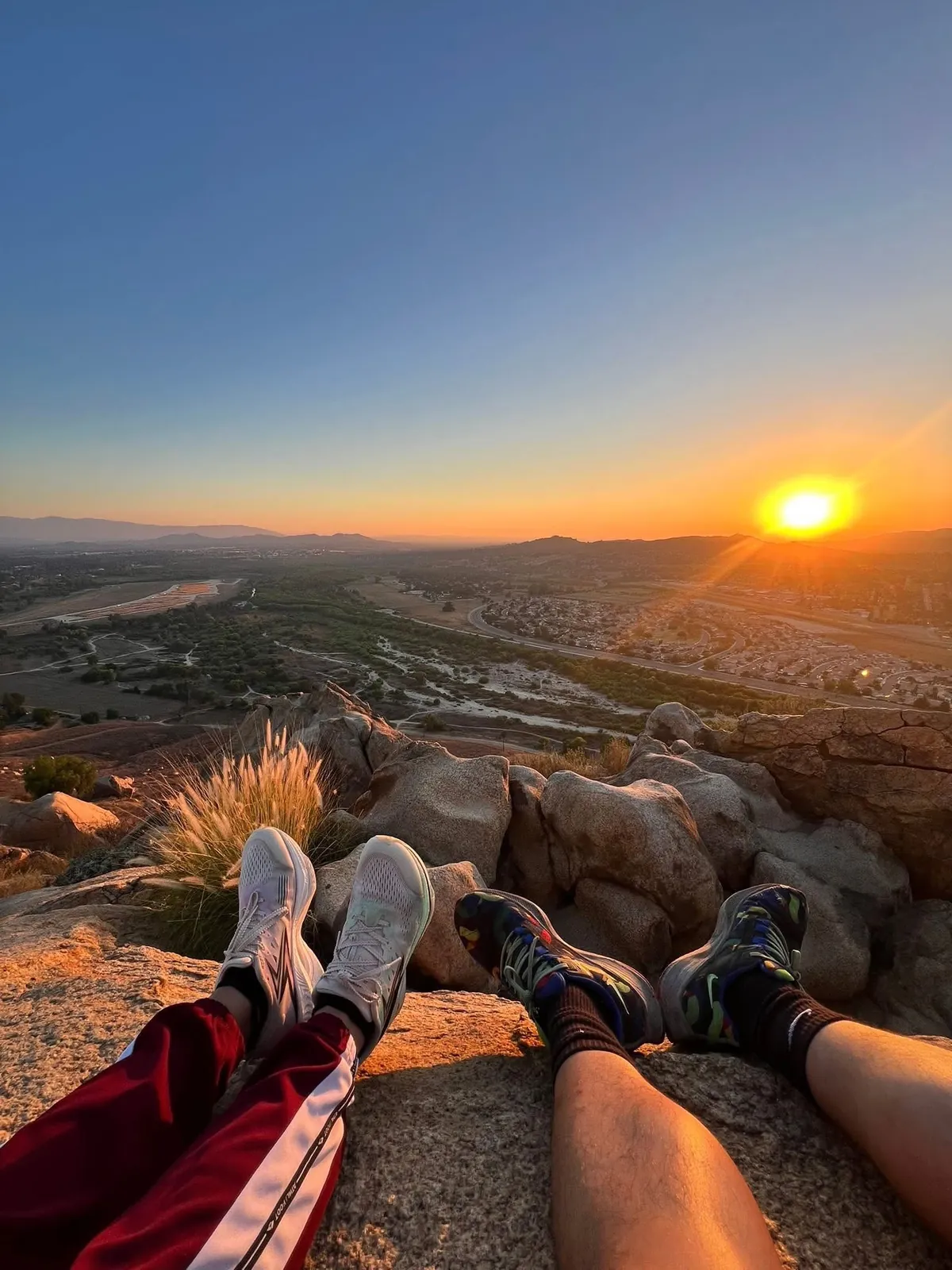 Watching the sunset from a rocky hiking viewpoint